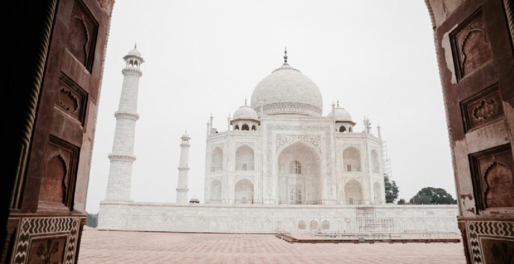 Tourists visiting the Taj Mahal during a Same Day Agra Tour, part of popular Agra Tour Packages.