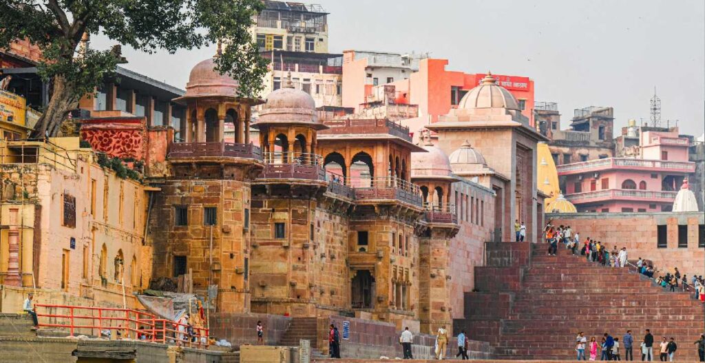 Image showcasing a vibrant scene from Varanasi, highlighting the spiritual essence of the city with devotees performing rituals at the Ghats. The photo represents a Same Day Tour in Varanasi, emphasizing the rich cultural and religious experiences of a 1 Day Tour in Varanasi. It also features glimpses of the popular Varanasi Tour Package, offering a memorable experience of the city's landmarks and traditions.